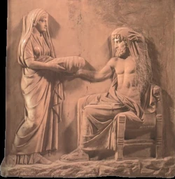 Reia apresenta a Cronos uma pedra envolvida em cueiros no lugar de Zeus. Relevo de mármore de 400 a.C