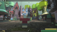 A player in the town square of Topple Town.