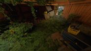 A key (bottom right) behind breakable wooden planks in Forgotten Barracks