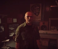 Dutch briefs the Deputy in the control room of his bunker.