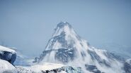 The mountain with the temple on top.