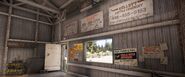 Flatiron Stockyards - Inside of the barn. Note the ammo crates near the door.