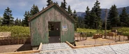 Flatiron Stockyards - Frontal view of the green shed with a note on the wall.