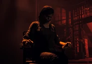 Hudson bound and gagged in John Seed's bunker.