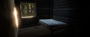 Red Tail Cabin - Bedroom with shotgun and ammo