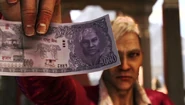 Pagan holding a Kyrati rupee with Eric's face printed on it