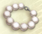 Bracelet de perles blanches.png