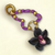 Collier orné d'une orchidée noire.png