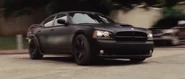 A full view of Dominic's Charger just after exiting the police station