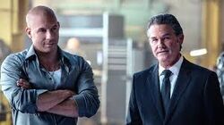 Dom and Mr. Nobody discuss their plan with the team to rescue Ramsey