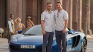 Caleb and Cody walker standing in front of the 12C