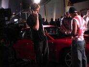 Paul Walker next to the Dodge Stealth during the filming of Turbo-Charged Prelude