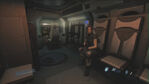 Interior of the Dark Signal APC, with Keira Stokes and Manuel Morales visible.