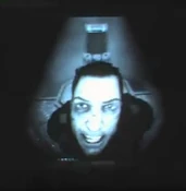 Close-up of Becket shown on tape in F.E.A.R. 3.