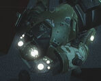 Closeup of a dead Replica Heavy Armor, showing the seventeen lights around the head.