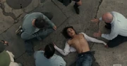 On the ground after being hit by the car (see the Trivia section, below).