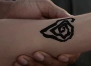 The design that Matt draws on Alicia's forearm.