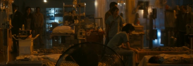 They find Dr. Exner sitting by the captive bolt cattle gun and staring at nothing, in a hospital ward full of dead patients.