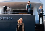 Madison, Ofelia and Alicia, looking at the yacht that was attacked