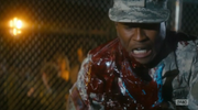 Liza sees a young African American soldier attacked by an infected man. The soldier draws his sidearm, puts the Infected man down and tries to stop the bleeding.