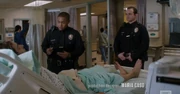 The police questioning Nick at Temple Hospital.