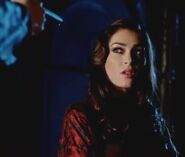 Foster Prentiss pointing a very dangerous weapon at Tara Garfield