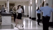 Get upstairs, people! Move it! All right, back up against the wall!