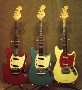 1966 Red, 1966 Blue, and 1965 White Fender Mustangs