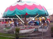 Boats kiddie umbrella ride (known as "Billy Bob's Harbor")