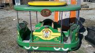 Chuck E. Cheese's trolley coin-op ride (painted red)