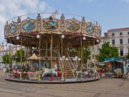 Old-fashioned style carousel with stairs imported from France