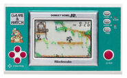 The ogirinal Donkey Kong Jr. New Wide Screen Game & Watch for comparison.