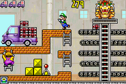 Wario climbing the ladder. Three trucks already loaded are indicated on top.