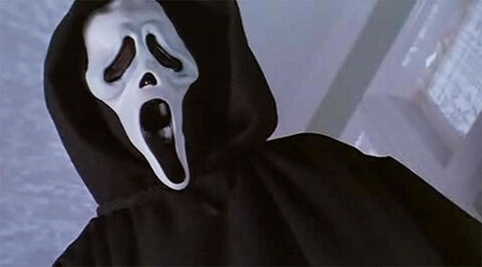 The man in white mask threatens, killer concept, horror theme