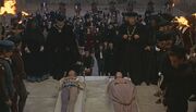 "See what a scourge is laid upon your hate?" (The Capulets and Montagues finally make peace.)