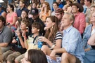 Edward, his wife and two sons watching at the racetrack.