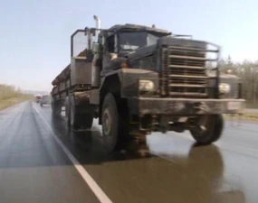 The truck shortly before its payload spills.