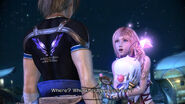 Mog being held by Serah while she talks to Noel.