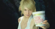 Lunafreya FFXV with Cup Noodle.png (531 KB) Advertisement with a Final Fantasy XV game scene altered to show Luna holding Cup Noodles.