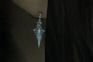 Close up of Lucrecia's earrings in Dirge of Cerberus -Final Fantasy VII-.