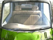 A dummied background of Laguna's green pick-up truck.