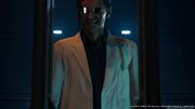 Hojo enters an elevator to his lab from FFVII Remake