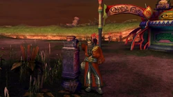 Auron outside Rin's Travel Agency in Mi'ihen Highroad.