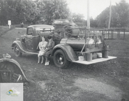 Ca. 1960 depicting two women as they pose for a picture with a fire truck belonging to the Township of Yarmouth. Courtesy Elgin County Archives.