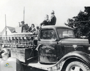 Ca. 1960 depicting a group of children riding on a Yarmouth Township Fire Department fire truck. Courtesy of the Elgin County Archives as part of the Township of Yarmouth fonds.