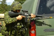 Canadian Military Policeman with C7A1 assault rifle, pictured during joint-training exercise, South Dakota, USA.