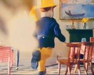 Sam rushing to put out the burning TV