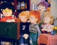 Bella, Dilys, Norman, James and Sarah watching Station Officer Steele on Bella's TV