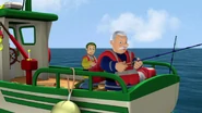 Station Officer Steele fishing on Charlie's boat
