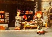 Norman riding a red skateboard while outside with Dilys in the 1988 annual (Note: The red skateboard Norman is riding belonged to Acorn in Rocky Hollow)